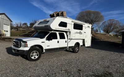 Photo of a 2004 Lance 1161 Cab Over Camper Mounted On A 2005 Ford F350 Lariat for sale